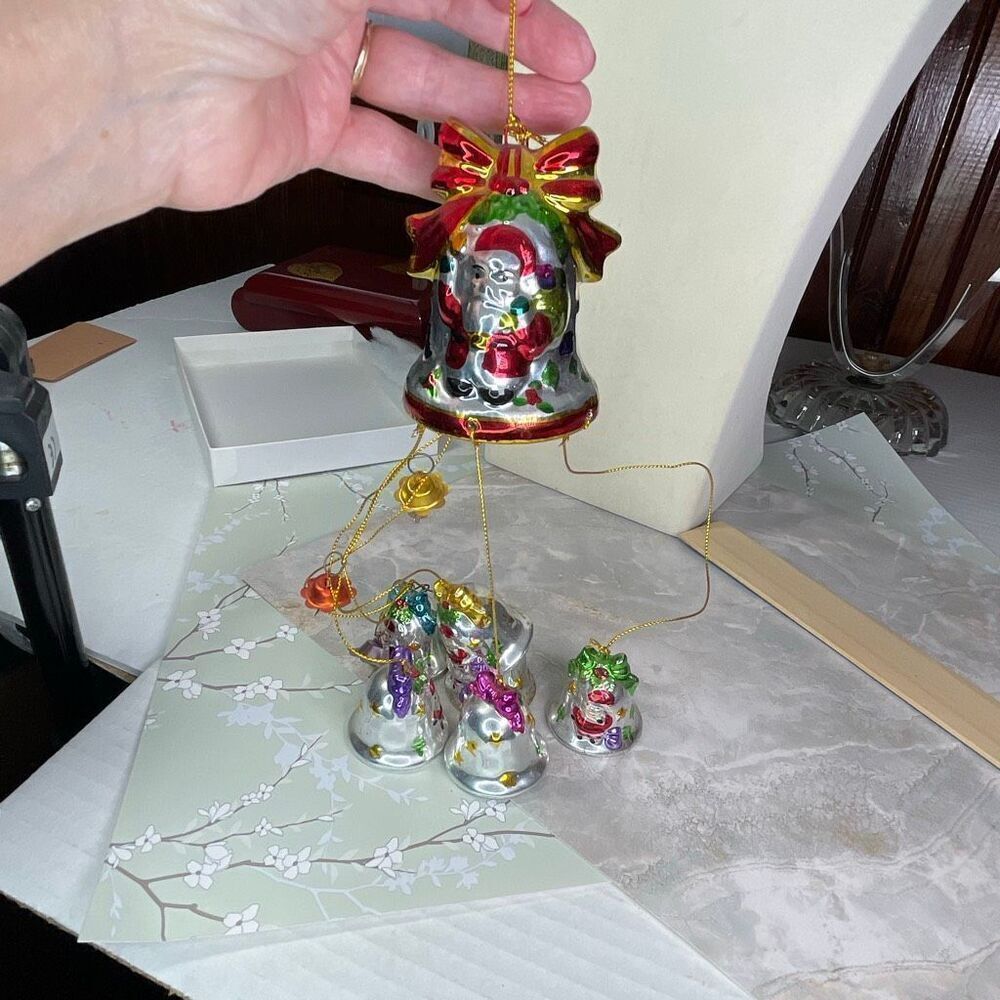 Vintage 1998 Avon Santa “Shimmering Bell ornament with Chimes”.